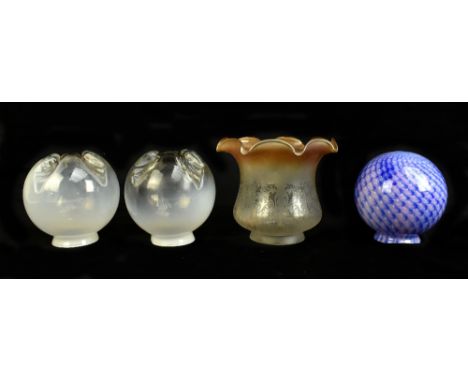 Two contemporary milk glass light shades of globular form with moulded floral decoration with amber coloured sections, height