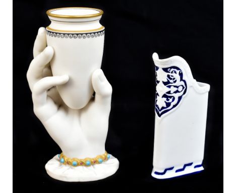 ROYAL WORCESTER; an unusual jug of triangular form, with moulded stylised decoration, height 12.5cm, together with a Royal Wo