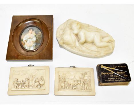 A small white marble carving of a sleeping child, length 8.5cm, two relief plaques, a printed portrait miniature and a small 