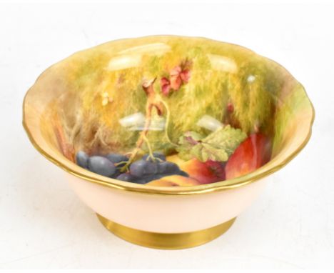 WILLIAM RICKETTS FOR ROYAL WORCESTER; a hand painted pedestal bowl decorated with fruit, signed, puce factory marks to base, 