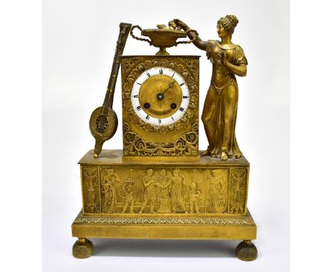 GILLION OF PARIS; a 19th century gilt metal mantel clock, the circular enamelled chapter ring set with Roman numerals, flanke