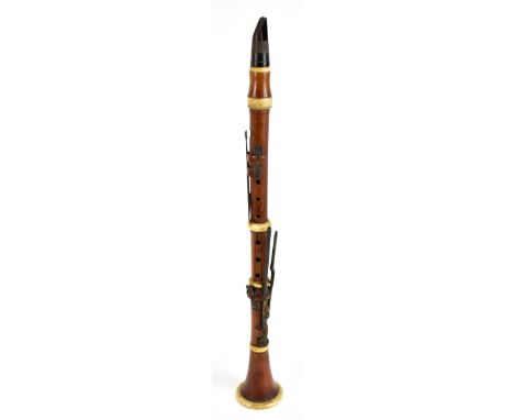 HERMANN WREDE OF LONDON; a boxwood clarinet with ivory mounts, stamped manufacturer's marks, length 60cm.Additional Informati