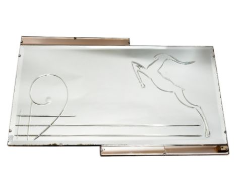 An Art Deco clear glass wall mirror of rectangular form decorated with a leaping gazelle flanked by two peach glass side pane