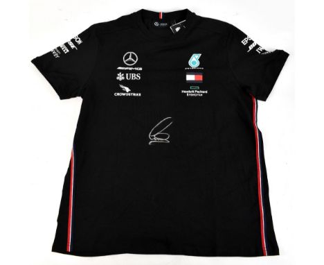 SIR LEWIS HAMILTON; a Mercedes Stichd official T-shirt with printed badge and sponsorship logos, signed to front, size L.Addi