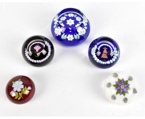 Five contemporary glass paperweights&nbsp;including a faceted example by Perthshire,&nbsp;diameter 7cm, fitted in original bo