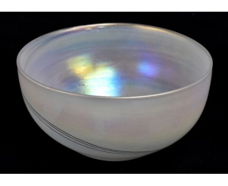 JOHN DITCHFIELD FOR GLASFORM; an art glass bowl with trailed linear decoration on a silver iridescent ground, signed to the r