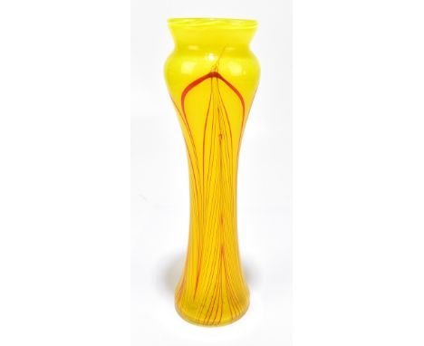 JOHN DITCHFIELD FOR GLASFORM; a contemporary glass vase of waisted form with red trailed decoration to a yellow body, signed 