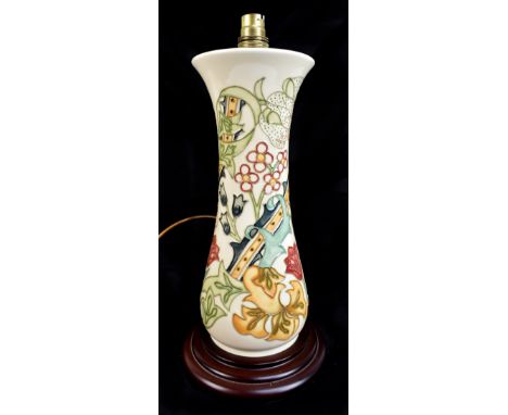 RACHEL BISHOP FOR MOORCROFT; a large cylindrical table lamp decorated in the 'Golden Lily' pattern, raised on turned wooden p