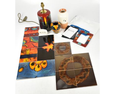 POOLE POTTERY; a group of modern ceramics to include twelve assorted tiles, a cylindrical table lamp, an easel back photograp