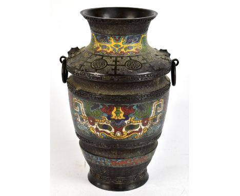 A late 19th/early 20th century Chinese champlevé enamel decorated twin ring handled vase with apocryphal mark to base, height