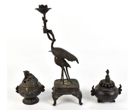 A Japanese bronzed candlestick in the form of two cranes, height 32cm and two Japanese bronzed incense burners (3).Additional