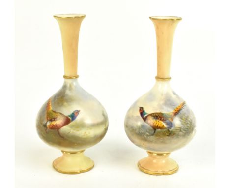 ROYAL WORCESTER; a pair of hand painted bulbous vases with flared necks, each painted with pheasants in a landscape setting, 