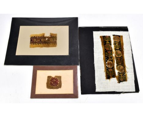 Three Coptic textile fragments, the first comprised of two border panels in brown, green, blue and orange and featuring styli