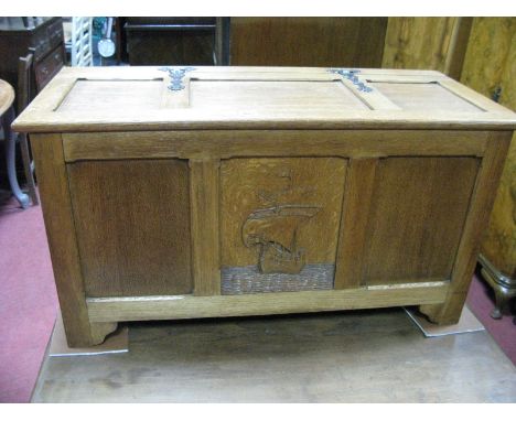 A XX Century Oak Blanket Box, with a hinged lid, three panelled base with central carved panel of a galleon, on a bracket fee