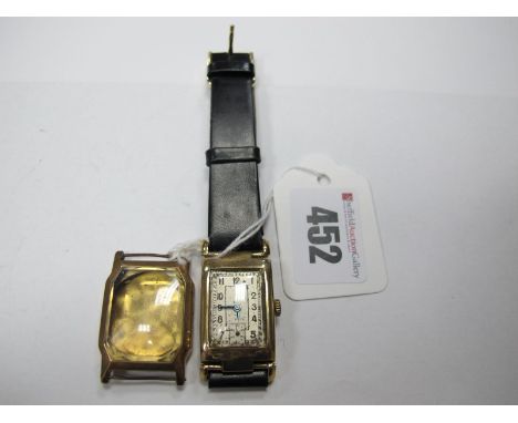 A 9ct Gold Cased Gent's Wristwatch, the rectangular dial with Arabic numerals and seconds subsidiary dial, on a strap; togeth