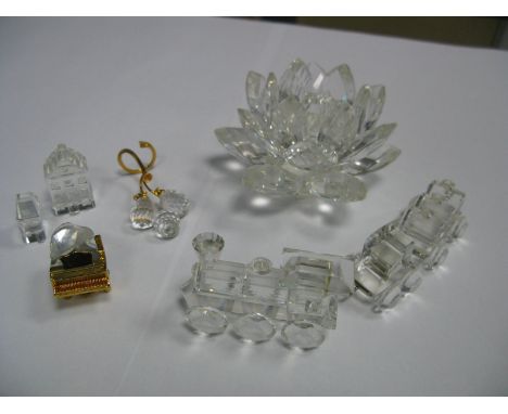 A Collection of Swarovski Crystal Models, including a locomotive with tender and wagon, a baby grand piano, two miniature mod