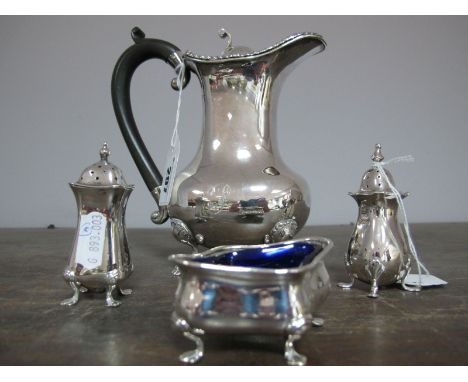 A Silver Hot Water Jug, having gadrooned border to scroll finial lid, ebonised handle on four paw feet, Sheffield 1904. Three