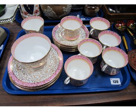 A Pheonix Bone China Tea Service, pink borders on a white ground with all over gilt printed foliate decoration.  