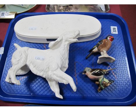 A Beswick Model of a Springer Spaniel, modelled in the white on an oval base, a Beswick model of a Chaffinch and a Goebel mod