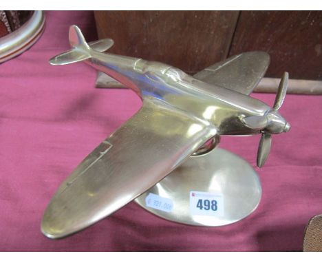 A Brass Model of a Spitfire, on an oval stand. 
