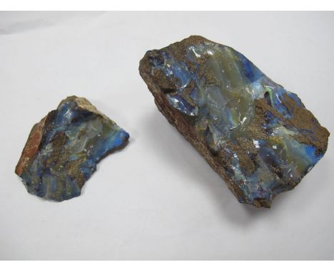 A Boulder Opal Rough Gem Specimen, 12.5cms long; together with another, smaller, 8.5cms long. (2)