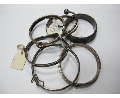 A Collection of Child's and Other Bangles, including hallmarked silver torque style bangle with ball ends, another with belt 