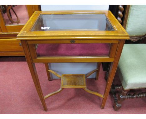 An Edwardian Inlaid Mahogany Bijouterie Cabinet, with lift-up lid, tapering legs, small under shelf united by shaped stretche