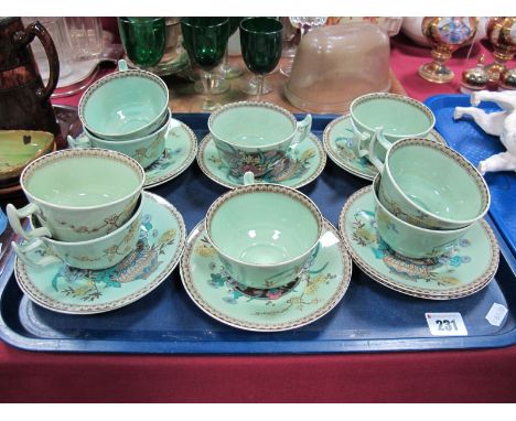 Clarice Cliff for Wilkinson Ltd, Newport pottery mid XX Century, nine floral breakfast cups and ten saucers, all on green gro