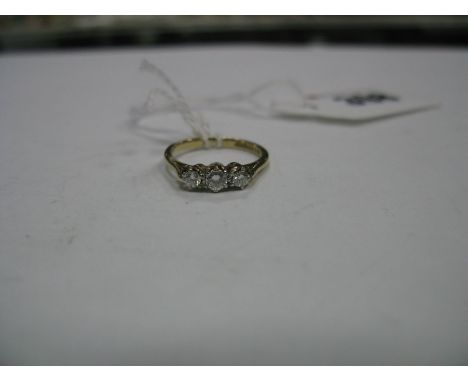 A 9ct Gold Three Stone Ring, graduated claw set.