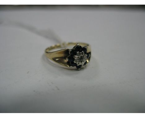 A 9ct Gold Cluster Ring, of flowerhead design, illusion set to the centre, between tapering shoulders. 