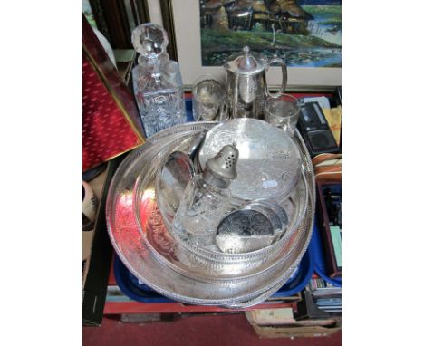 Three Electroplated Circular Gallery Trays, pierced and cast boarders, a similar oval example, an electroplated hot water jug