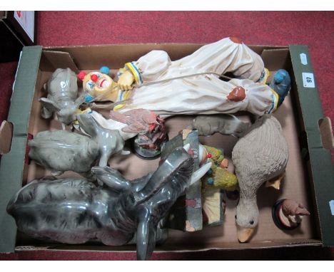 Three Continental China Graduating Model Elephants, 24cms and smaller, a model clown with rope, a resin 'Clown in Suitcase', 