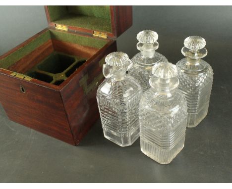 A Georgian mahogany decanter box of square formHaving two military type handles, the hinged cover enclosing four assorted hob
