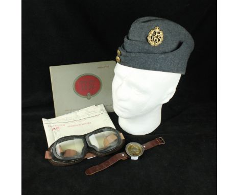 A WWII period RAF side cap and badge Pair of goggles, a wrist mounted compass, a pilots escape map for Stepnoy and Stalingrad