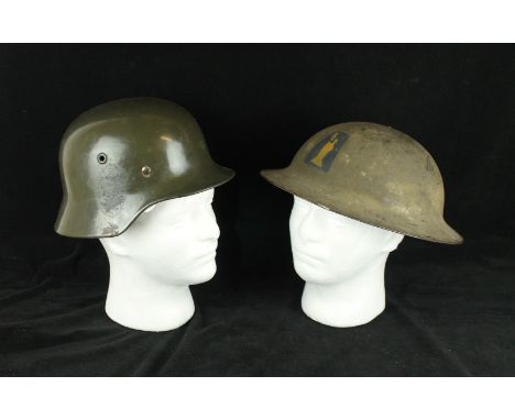 A WWII period Nazi Germany army green painted helmetWith inner leather lining, inside stamped MN, United States of America Br