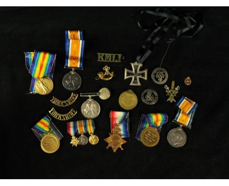 A collection of WWI medals Including medal group awarded to 14431 Private T J Baines of the Kings own Yorkshire Light Infantr