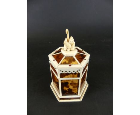 A early 20th Century Chinese bone and tortoiseshell boxOf hexagonal form, the hinged cover with finial depicting an Oriental 