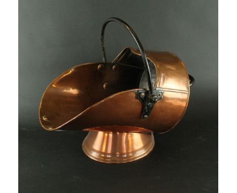An early 20th Century copper coal scuttleWith black metal swing handle, with military impressed arrow to top, by Lee & Wilkes