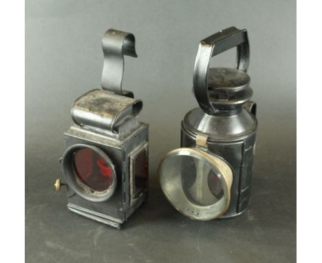 Two Vintage railway lanterns
The first example of cylindrical form with brass plaque entitled 'LMS 48013', height 30cm, the s