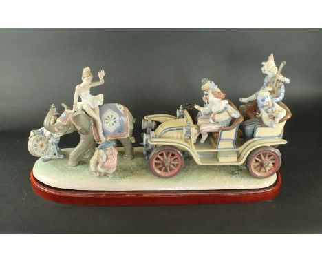 A large Lladro figure group 'Circus Parade'
No. 731/1000, raised on a wooden plinth base, length 72cm. CONDITION REPORT: Clow