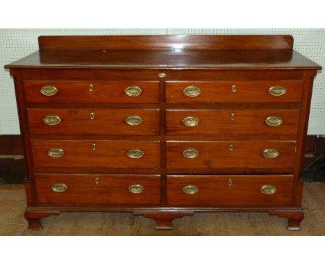 A Georgian mahogany mule chest With hinged lid, brass fittings, four dummy drawers above four oak lined drawers, raised on og