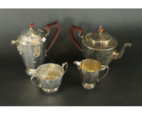 A George V silver four piece tea serviceComprising teapot, hot water jug, milk jug and sugar basin, largest two pieces fitted