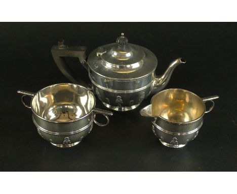 An Edward VII three piece silver batchelor's tea serviceComprising teapot with ebony handle, double handled sugar basin and a