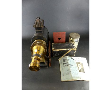 A Vintage metal magic lanternTogether with a quantity of glass slide, relating to the book 'Four Lessons' produced by David L