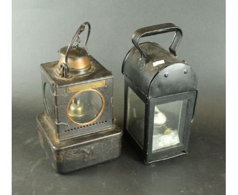 Two Vintage railway lamps
The first example of square form with stepped base, entitled 'Welch Patent', the second example ent