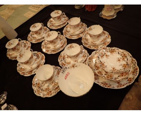 Nine Edwardian ceramic floral trios cake plate sugar etc 