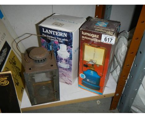 Two candle lamps and a gas lamp.