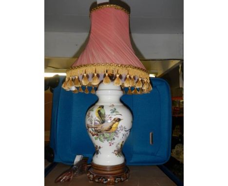 A Chinese style table lamp decorated with birds.