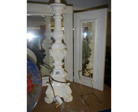 A tall white painted table lamp base.