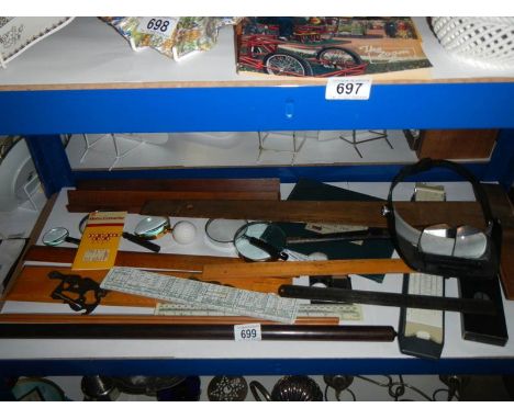 A mixed lot of measuring tools including rulers, ships ruler etc.